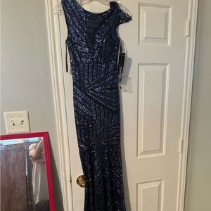Selling my brand new never worn black long formal with blue beads